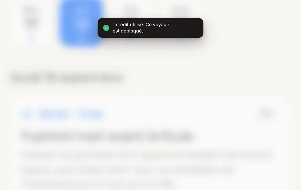 Une notification « 1 crédit utilisé. Ce voyage est déverrouillé. » au-dessus d'un itinéraire de voyage.