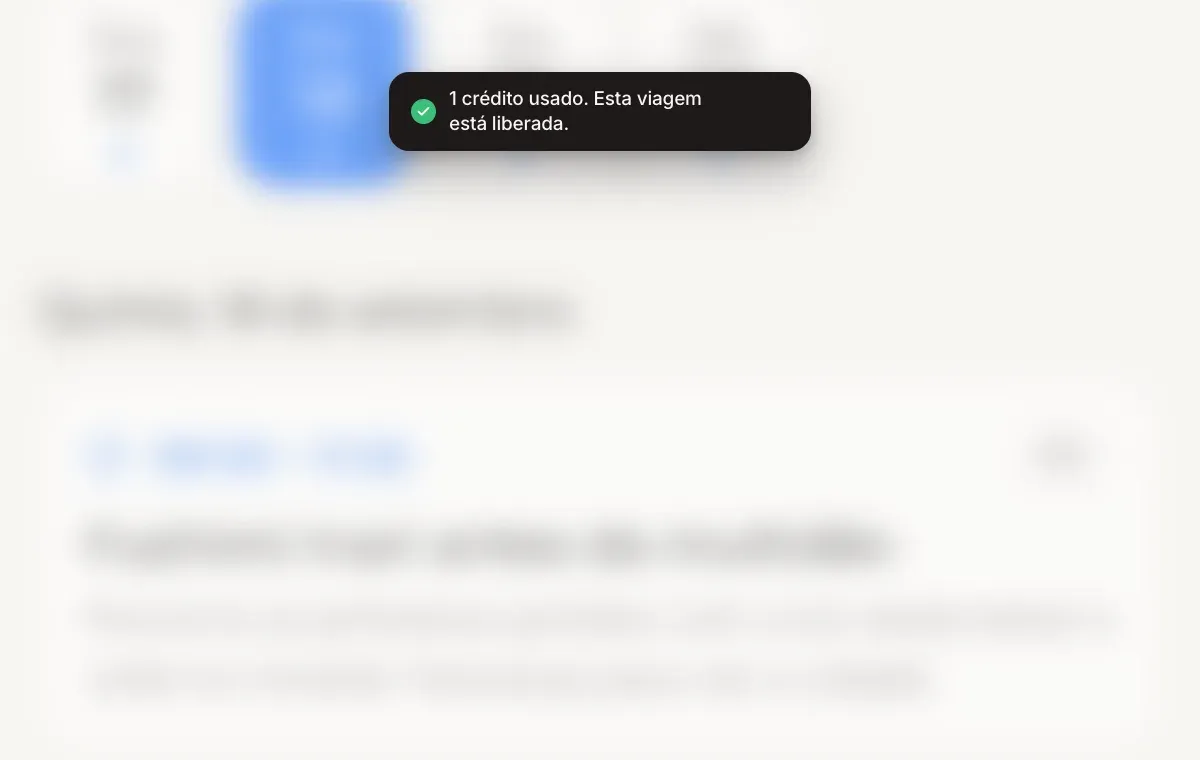 Um aviso com o texto "1 crédito usado. Esta viagem está desbloqueada." sobre um roteiro de viagem.